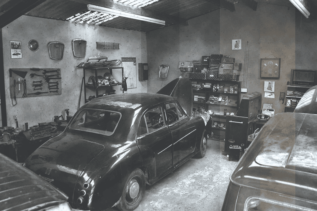 The first studio of Prasanna Gunawardana in a garage with a classic car