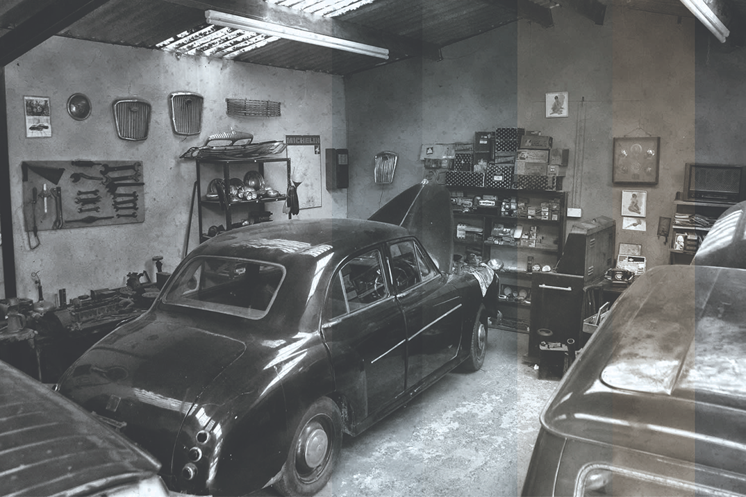 The first studio of Prasanna Gunawardana in a garage with a classic car